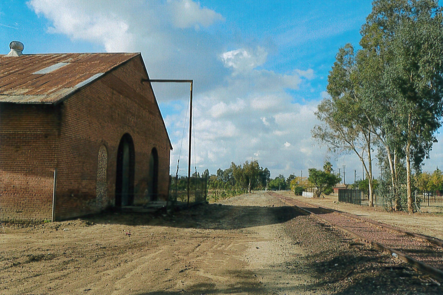North and east facades, railroad tracks